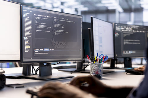 close-up-server-hub-it-professional-debugging-optimizing-code (1) (1)